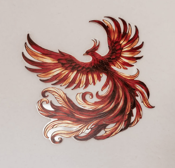 image d'un phénix décoratif accroché au mur du cabinet d'une thérapeute en constellations familiales et systémiques exerçant près de Lausanne, en Suisse, à Morges et Renens